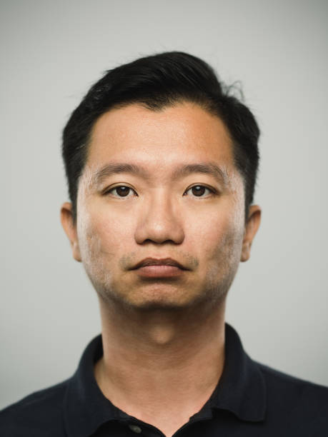 Portrait of real chinese man with serious expression