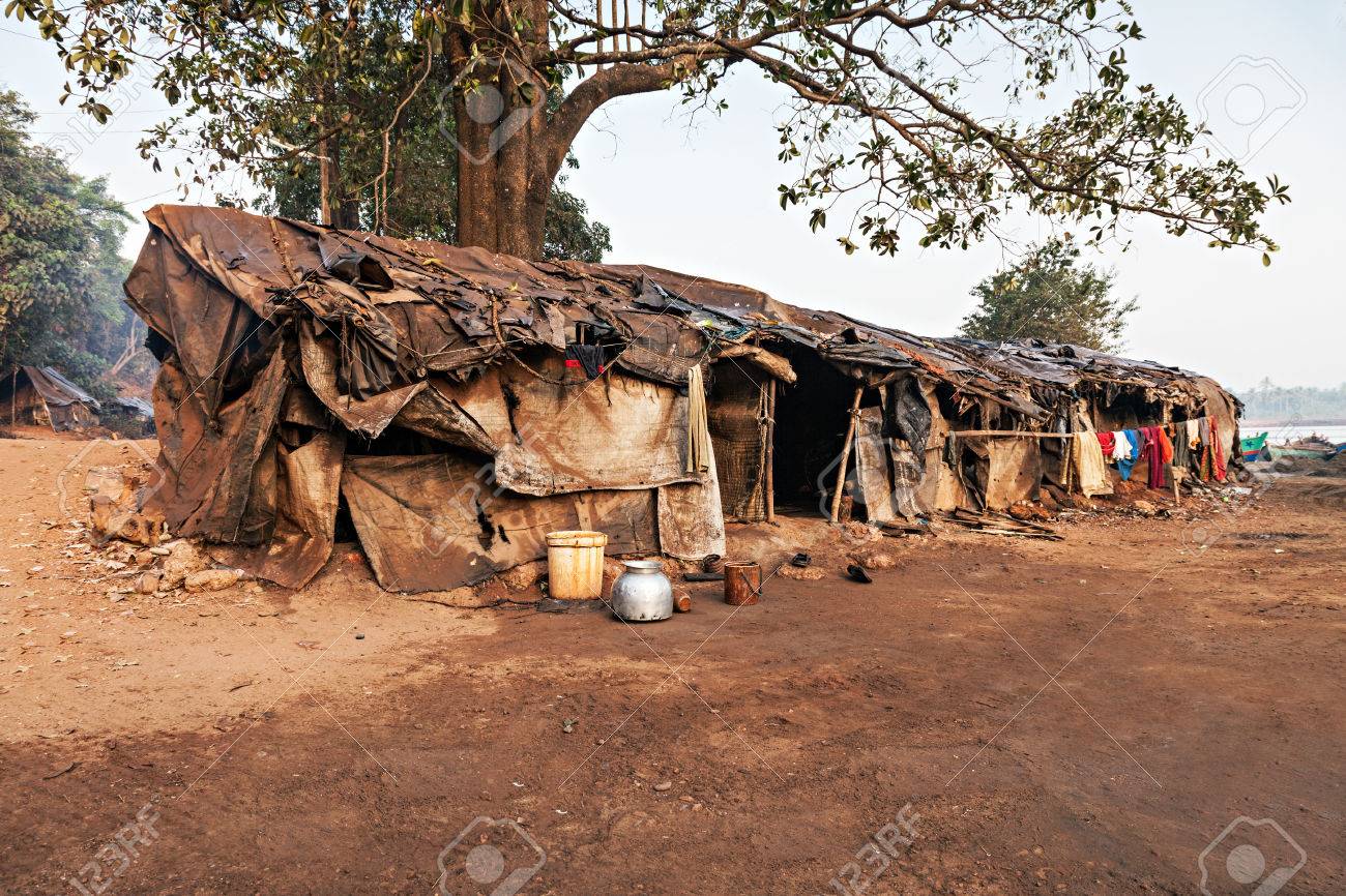 57995661 slum house near the river goa india