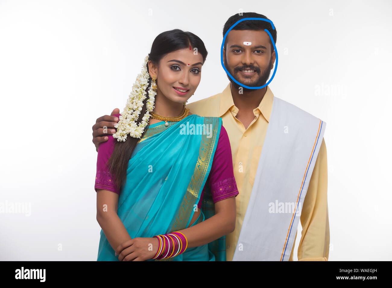 Portrait of a south indian couple smiling at the camera WAEGJH