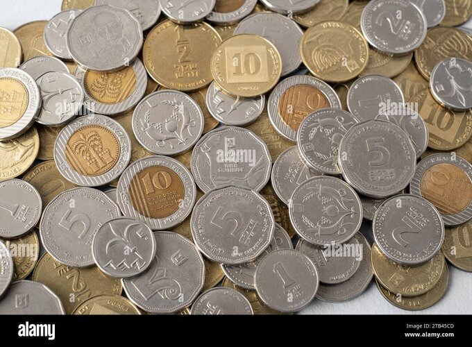 Israels new shekel nis coins in heap israel currency money cash coins of various denominations