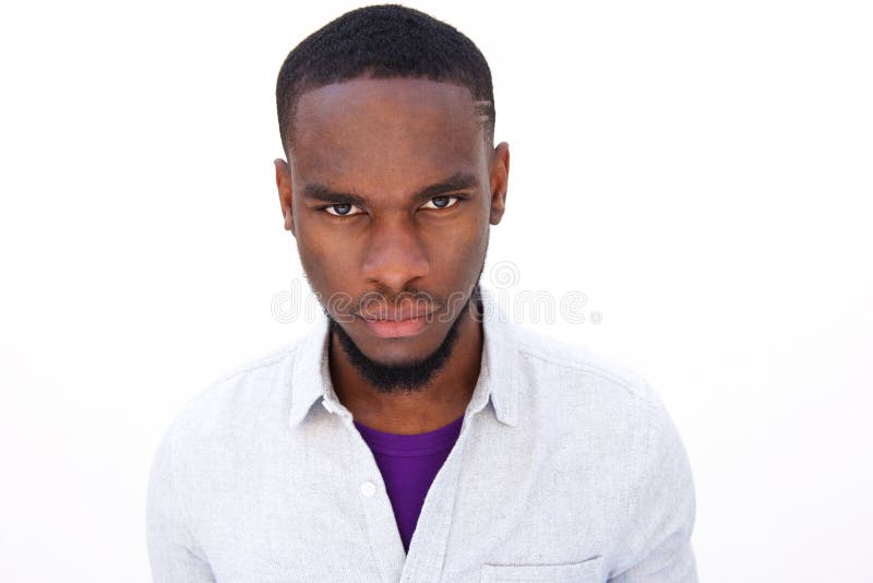 Young african man staring camera close up portrait against white background 67437340