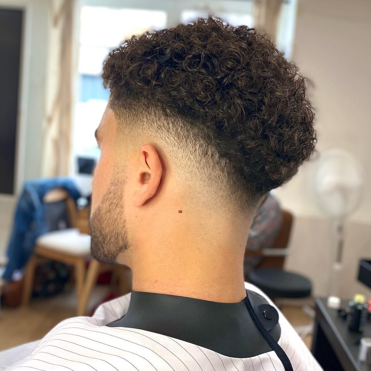 Mid fade curly haircut edited