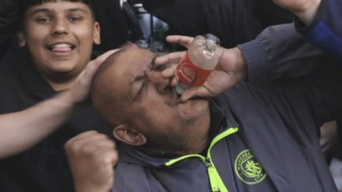 Man City fan drinking from Arsenal bottle 1320x742