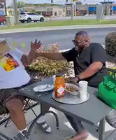 Two people laughing on table