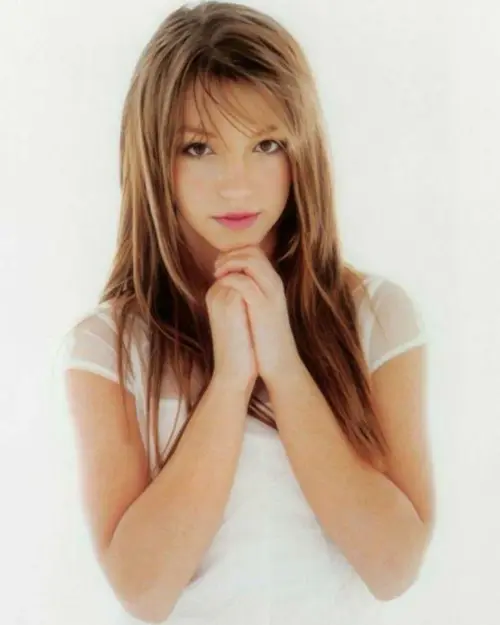Britneys-baby-one-more-time-album-photoshoot-v0-gr8myx5g3ekc1 (1).webp