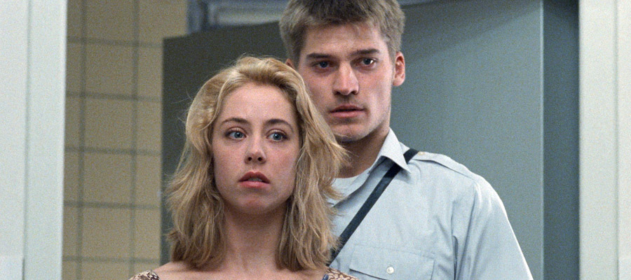 Nikolaj Coster Waldau as Martin Bork and Sofie Grabol as Kalinka Martens stand at the door of 