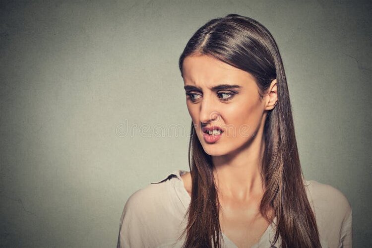 Disgusted woman portrait looking sideways 57640925