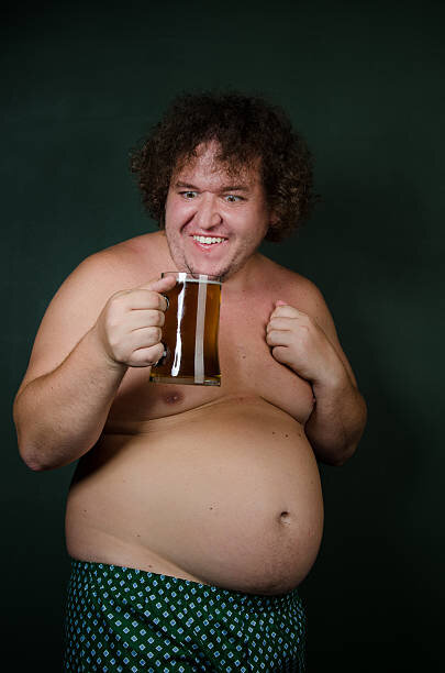 Funny fat man with glass of beer