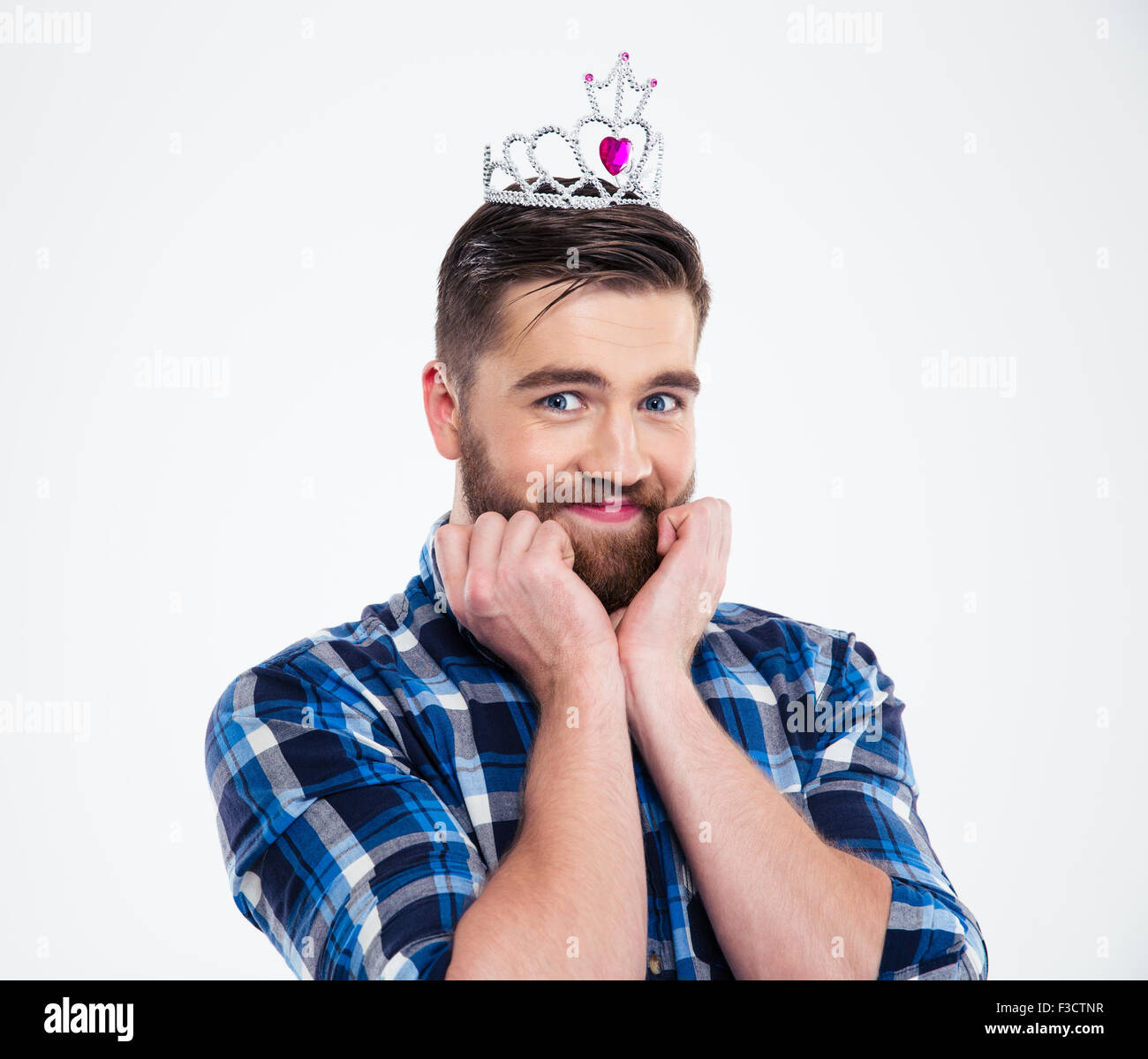 Portrait of a happy feminine man in queen crown standing isolated F3CTNR