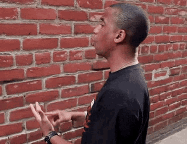 Guy talking to wall speaking to wall