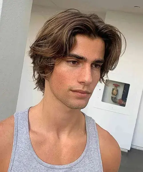 layered-middle-part-haircut-men.webp
