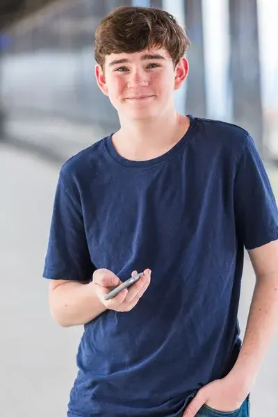 depositphotos_83085984-stock-photo-teenage-boy-at-the-lightrail.webp
