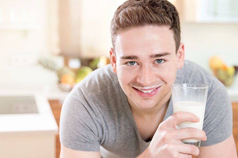 Guy drinking milk 800