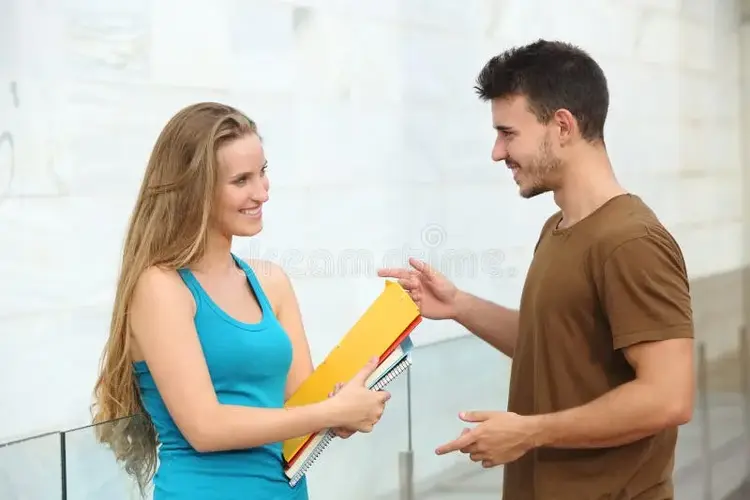students-talking-happy-outdoor-two-boy-girl-outside-campus-34610291.webp