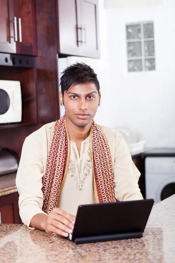 Indian man using laptop 23386706