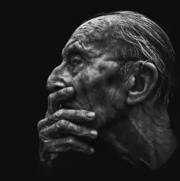 Old man covering mouth