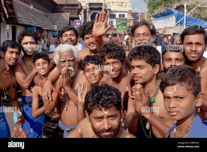 a-group-of-all-male-cheerful-and-excited-hindu-pilgrims-posing-in-front-of-padmanabhaswamy-tem...jpg