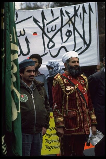 Syrians demonstrating against pres assad also soviet pres brezhnevs presence at russian german